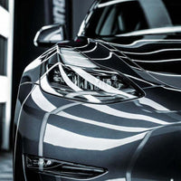 XPEL Lakkbeskyttelse SGN BASE applied on a sleek gray car exterior showcasing its glossy finish.