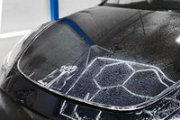 XPEL Lakkbeskyttelse SGN BASE applied on a car hood, showcasing its protective qualities against scratches and UV rays.