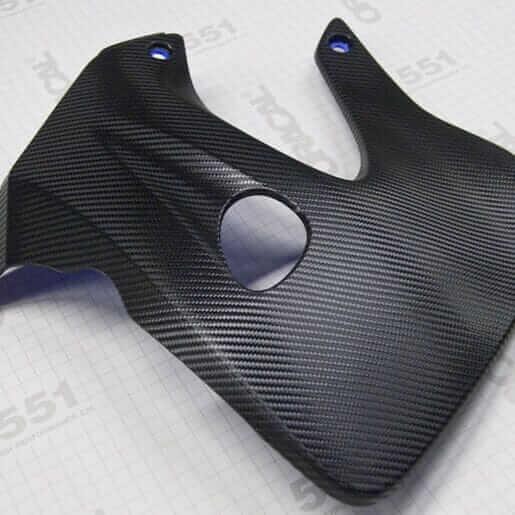 Carbon car wrapping detail showing a textured carbon fiber piece for automotive enhancement.